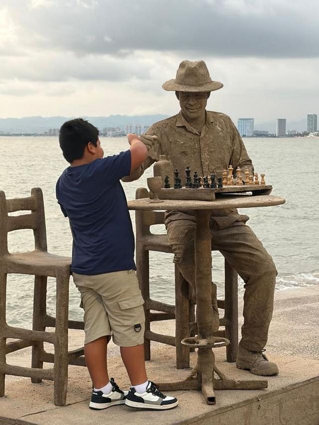 Puerto Vallarta waterfront sculpture and chess scene by the bay
